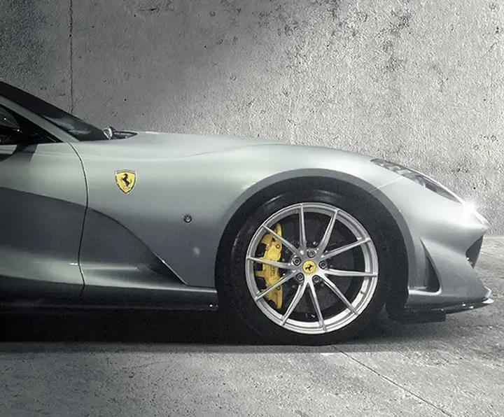 Silver Ferrari with concrete backdrop