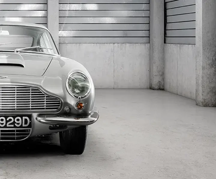 Classic Aston Martin in concrete garage